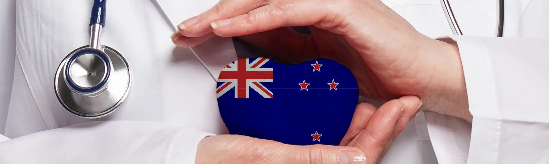 new-zealand-doctor-holding-heart-flag